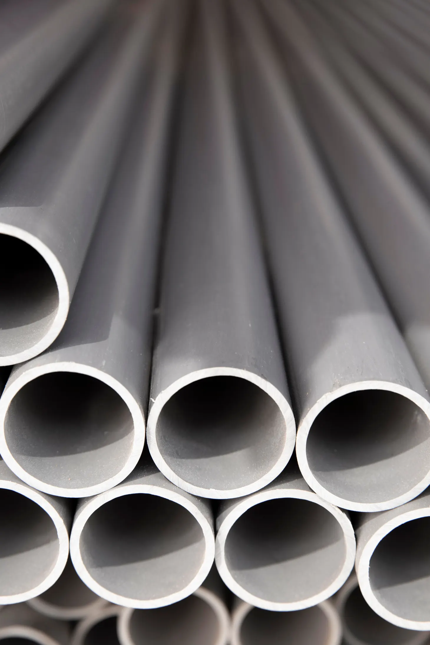 Close-up of grey thermoplastic pipe ends showing wall thickness